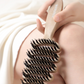 Cepillo para el cabello con cerdas de jabalí y diseño curvo