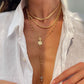 Colliers superposés avec croix dorées pour femme