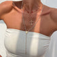 Colliers superposés avec croix dorées pour femme