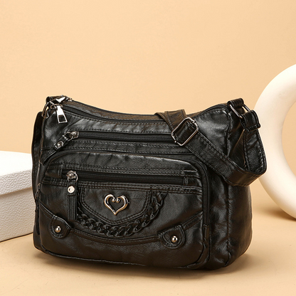 Sac bandoulière pour femme en simili cuir souple multi-poches