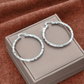 Boucles d'oreilles créoles texturées minimalistes pour femme – Bijou rond statement